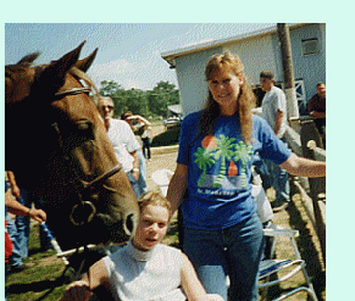 Tricia with her mom Pat and a horse